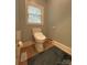 Toilet room features modern fixtures and a window to let natural light in the space at 11646 Hidden Forest Ln, Davidson, NC 28036