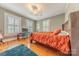 Bedroom with hardwood floors, a bed, a desk, and three windows for ample natural light at 119 Foote St, Chester, SC 29706