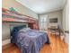 Bedroom with bunk beds, desk, and hardwood floors, creating a functional space at 119 Foote St, Chester, SC 29706