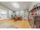Spacious dining room featuring natural light, hardwood floors, and a built-in bar at 119 Foote St, Chester, SC 29706