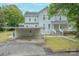 Charming two-story home with a covered parking area, well-maintained lawn, and a classic design at 119 Foote St, Chester, SC 29706