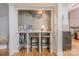 Hallway features counter with decor, seating, and decorative flower art piece above at 119 Foote St, Chester, SC 29706