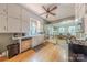 View of the kitchen, including stainless appliances and ample counter space, looking into dining area at 119 Foote St, Chester, SC 29706