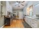 Well-lit kitchen with stainless appliances, hardwood floors, and plentiful white cabinetry at 119 Foote St, Chester, SC 29706