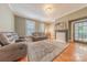 Cozy living room with a fireplace, hardwood floors, and comfortable, leather seating at 119 Foote St, Chester, SC 29706