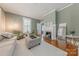 Inviting living room featuring a decorative fireplace, comfortable seating, and ample natural light from shuttered windows at 119 Foote St, Chester, SC 29706