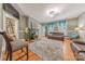 Living room with fireplace, hardwood floors, two sofas, and a large gray rug at 119 Foote St, Chester, SC 29706