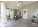 Screened-in porch features cozy seating, sheer curtains, and a ceiling fan, perfect for relaxing outdoors at 119 Foote St, Chester, SC 29706
