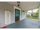 Inviting porch with decorative railing, patterned door, and a cozy, welcoming ambiance at 119 Foote St, Chester, SC 29706