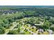 Quiet neighborhood featuring green lawns and mature trees offering a peaceful and idyllic setting for residential living at 11922 Kimberfield Rd, Matthews, NC 28105
