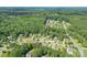 Beautiful neighborhood with mature trees and landscaping surrounding well-maintained homes, exuding a serene atmosphere at 11922 Kimberfield Rd, Matthews, NC 28105