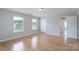 Spacious bedroom with two large windows and hardwood floors, offering ample natural light at 11922 Kimberfield Rd, Matthews, NC 28105