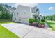 Two-story home with a two-car garage, long driveway, and manicured landscaping at 11922 Kimberfield Rd, Matthews, NC 28105