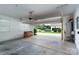 Garage with opened door, piano, and water heater in the corner at 11922 Kimberfield Rd, Matthews, NC 28105