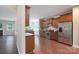 Modern kitchen featuring stainless steel appliances, dark wood cabinets, and hardwood floors at 11922 Kimberfield Rd, Matthews, NC 28105