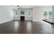 Spacious living room with hardwood floors, fireplace, and sliding glass doors to the backyard at 11922 Kimberfield Rd, Matthews, NC 28105