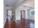 Bright living room with coffered ceilings, hardwood floors, and modern chandelier fixture at 11922 Kimberfield Rd, Matthews, NC 28105
