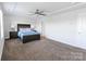 Bedroom with tray ceilings and soft carpet at 11965 Hambright Rd, Huntersville, NC 28078