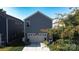 Detached garage with neutral siding and green landscaping in a suburban setting at 11965 Hambright Rd, Huntersville, NC 28078