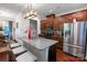 Modern kitchen featuring a granite-topped island, stainless steel appliances, and ample counter space at 11965 Hambright Rd, Huntersville, NC 28078