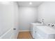 Bright laundry room with white washer and dryer at 11965 Hambright Rd, Huntersville, NC 28078