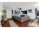 Spacious living room with wood floors, featuring an entertainment center, and modern decor at 11965 Hambright Rd, Huntersville, NC 28078