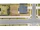 Overhead shot of a home with lush landscaping in a neighborhood with sidewalk-lined streets at 12205 Hollinhope Dr, Charlotte, NC 28278