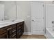 Bathroom featuring a double vanity, full mirror, and combination tub and shower at 12205 Hollinhope Dr, Charlotte, NC 28278