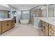 This bathroom features double vanities, soaking tub, and a large glass shower enclosure at 12205 Hollinhope Dr, Charlotte, NC 28278