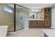 Bright bathroom featuring a glass shower, soaking tub, double vanity, and linen closet at 12205 Hollinhope Dr, Charlotte, NC 28278