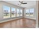 Bright bedroom with hardwood floors and multiple windows at 12205 Hollinhope Dr, Charlotte, NC 28278