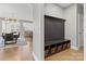 Entryway features a built-in storage unit with baskets, coat hooks and view of dining area with chandelier lighting at 12205 Hollinhope Dr, Charlotte, NC 28278