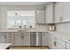 Bright kitchen featuring stainless steel appliances and light gray cabinetry at 12205 Hollinhope Dr, Charlotte, NC 28278