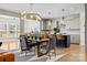 Open-concept kitchen with dining table, stainless steel appliances, and island with seating at 12205 Hollinhope Dr, Charlotte, NC 28278