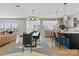 Open-concept living and dining area with modern furnishings and hardwood floors at 12205 Hollinhope Dr, Charlotte, NC 28278