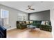 Comfortable living room with a large sectional sofa, and large windows at 12205 Hollinhope Dr, Charlotte, NC 28278