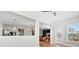 Open-concept living area with hardwood floors and access to the backyard at 12205 Hollinhope Dr, Charlotte, NC 28278