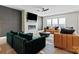Cozy living room with a modern fireplace, mounted TV, comfortable seating, and ample natural light at 12205 Hollinhope Dr, Charlotte, NC 28278