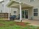 Outdoor covered patio, perfect for entertaining with a grill and seating area at 13314 Pontchatrain Ave, Charlotte, NC 28273