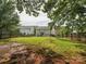 Huge backyard surrounded by trees and a fence, offering plenty of room and privacy at 13314 Pontchatrain Ave, Charlotte, NC 28273