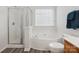 Bathroom featuring a glass shower, soaking tub, natural light, and modern fixtures at 13314 Pontchatrain Ave, Charlotte, NC 28273