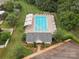 Aerial view of the community pool with lounge chairs, tables, and shaded areas at 13314 Pontchatrain Ave, Charlotte, NC 28273