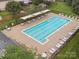 Overhead shot of a pristine community pool with shaded seating and ample lounge space at 13314 Pontchatrain Ave, Charlotte, NC 28273