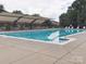 Well-maintained community pool with a clear blue swimming area and shaded seating at 13314 Pontchatrain Ave, Charlotte, NC 28273