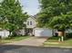 Charming two-story home with a well-manicured lawn and a two-car garage at 13314 Pontchatrain Ave, Charlotte, NC 28273