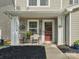 Close-up of a cozy front porch with decorative details and inviting seating at 13314 Pontchatrain Ave, Charlotte, NC 28273