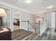 Upstairs landing with a view into a carpeted bedroom at 13314 Pontchatrain Ave, Charlotte, NC 28273