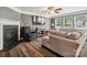 Comfortable living room with a fireplace, a television, and large windows at 13314 Pontchatrain Ave, Charlotte, NC 28273