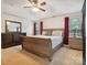 Spacious primary bedroom features a tray ceiling, natural light, and a matching bedroom set at 13314 Pontchatrain Ave, Charlotte, NC 28273