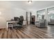 Bright home office with wood floors, a desk, and comfortable seating area at 13314 Pontchatrain Ave, Charlotte, NC 28273